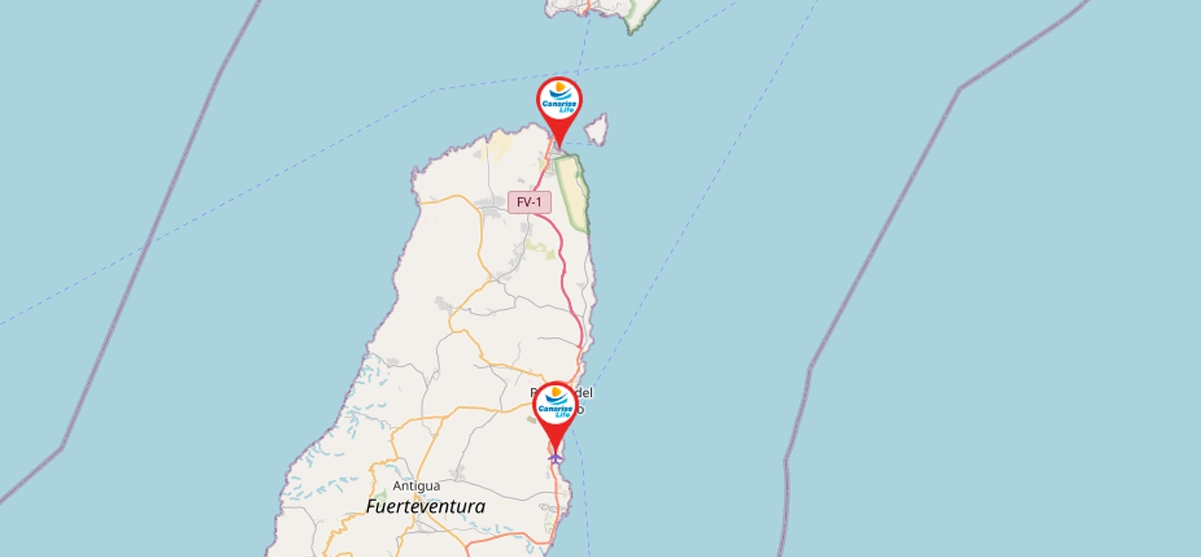 Mapa de la isla de Fuerteventura con la localización de dos webcams turísticas marcadas con iconos, una en el extremo norte junto a la FV-1 y otra en la zona este cercana a Puerto del Rosario, sobre fondo de mapa marítimo.